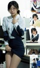 A woman in a school uniform sitting at a desk.